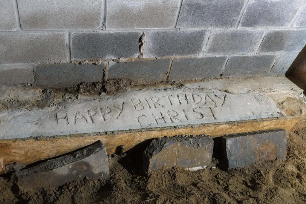 Happy Birthday Christ, written in concrete